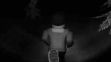Robbie holding a flashlight in dark foggy woods facing Slender Man in Robbie vs Slender: Forest Escape
